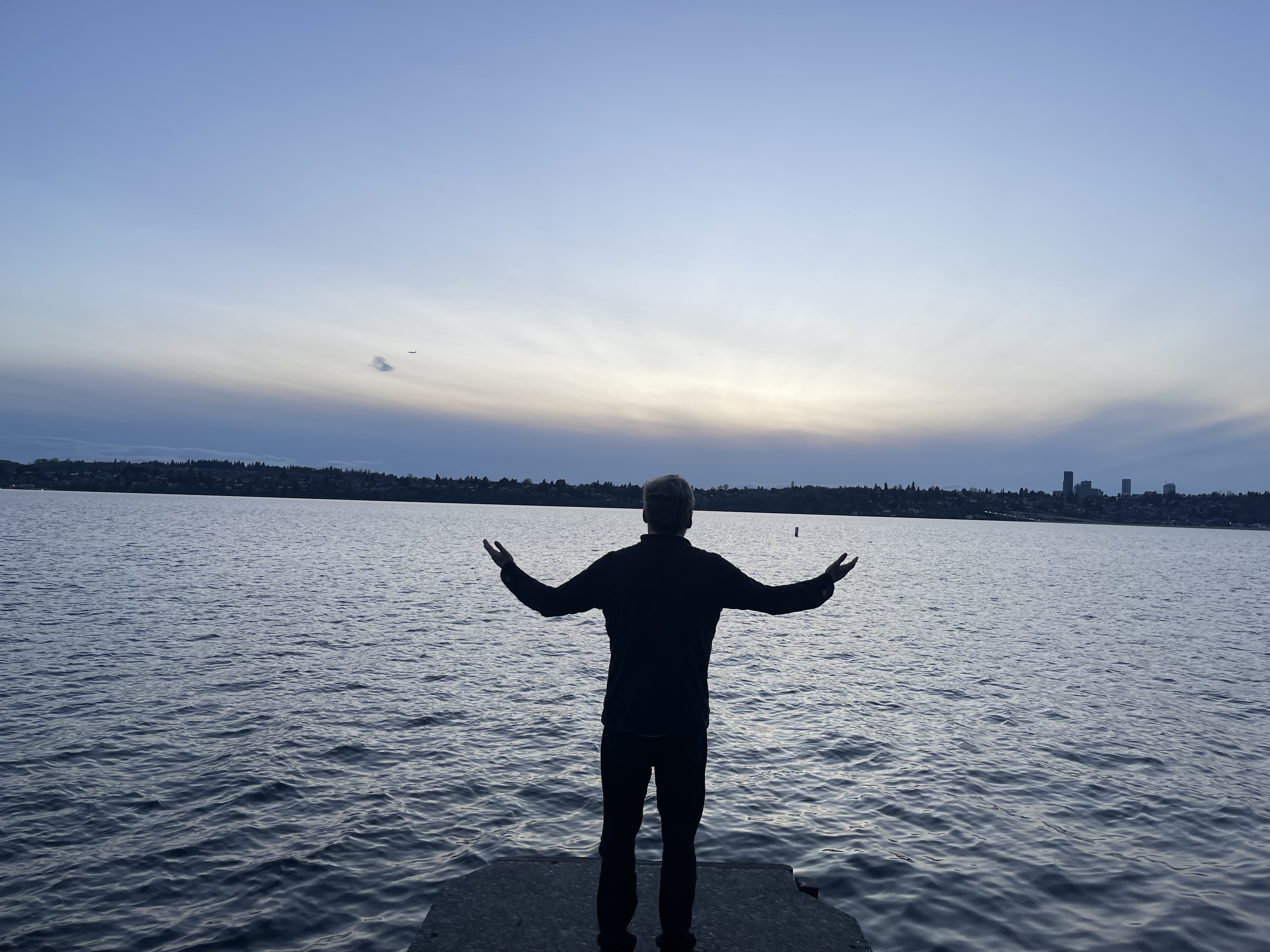 Joe Hardy silhouette at waterfront at dusk — Mercer Island